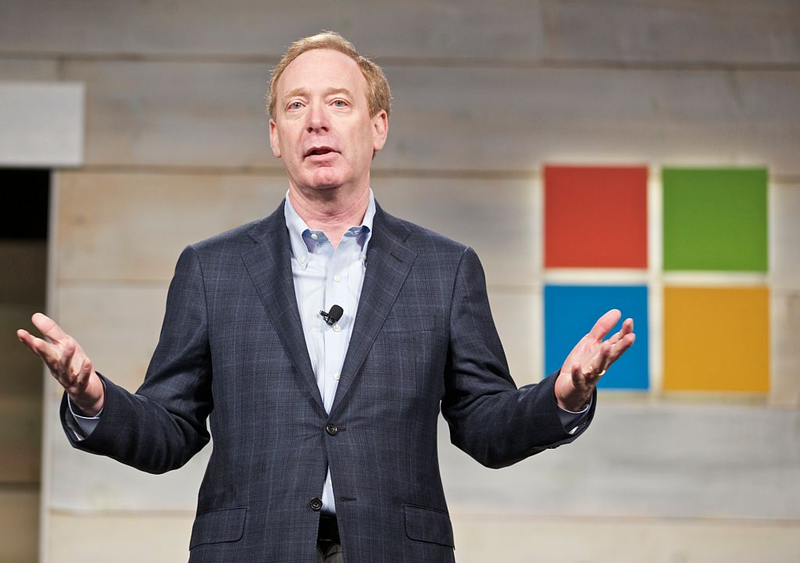 Brad Smith addresses shareholders during Microsoft Shareholders Meeting December 3, 2014 in Bellevue, Washington (Photo by Stephen Brashear/Getty Images)